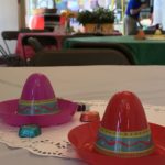small toy sombreros on a table