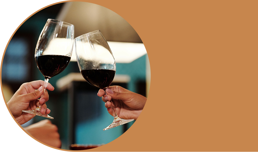 An image of two people clinking wine glasses