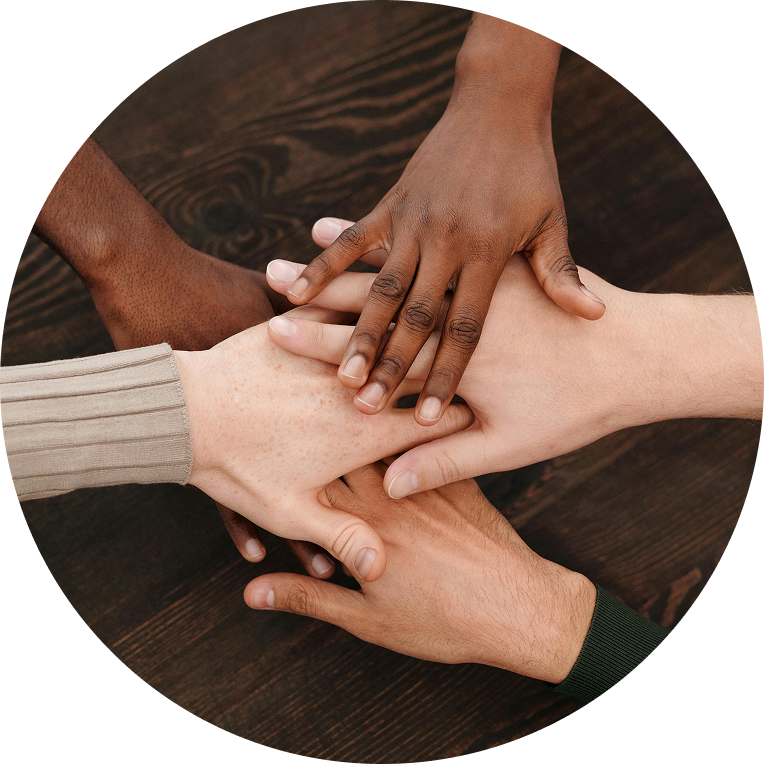 An image of a diverse group of hands coming together