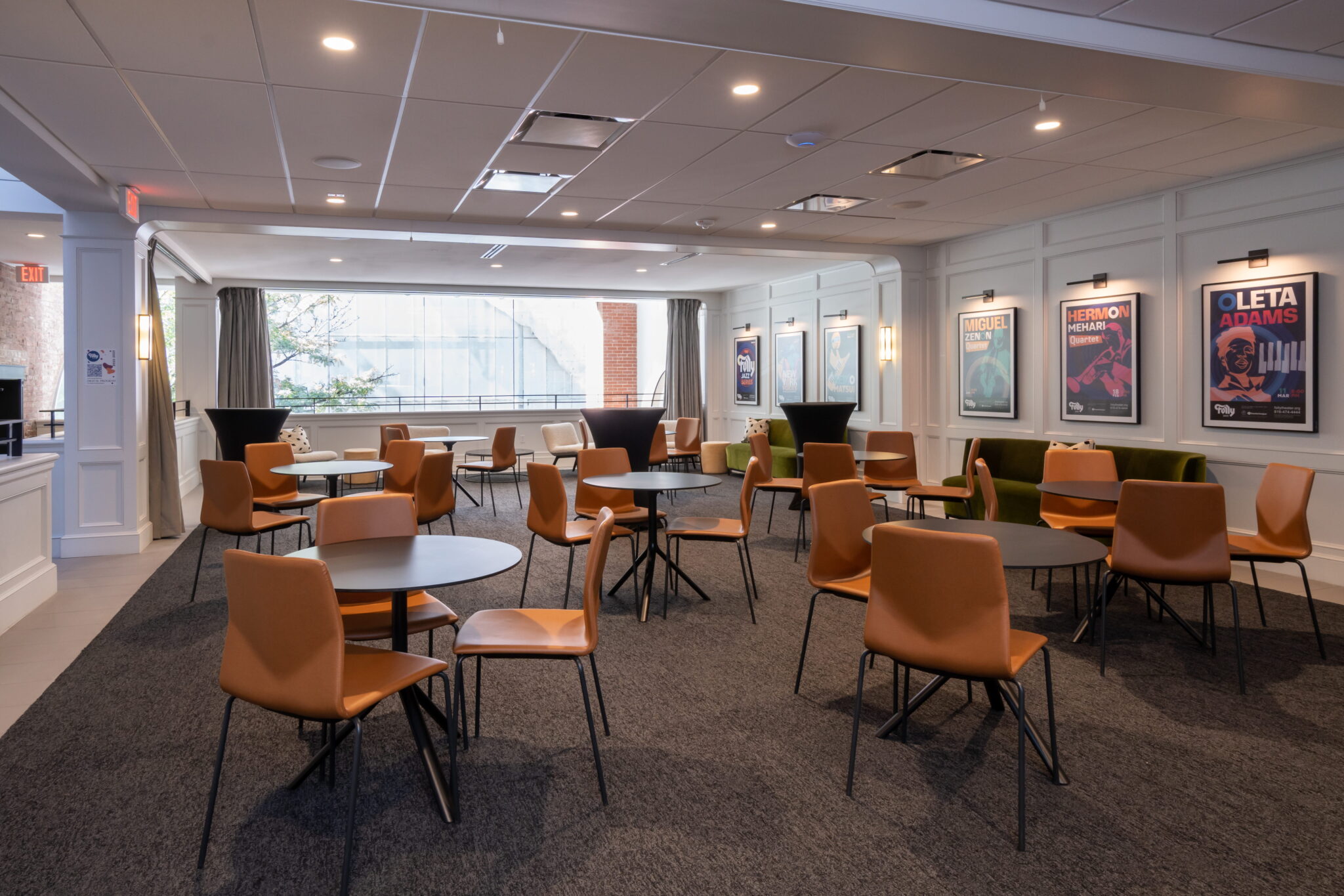 Tables and chairs set up nicely in a room